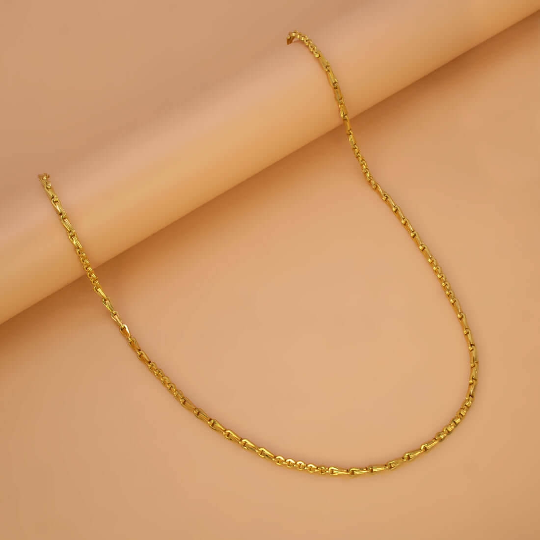 Stylish Gold Plated Cutting Bhanu Priya Chain displayed on a smooth background, featuring polished links.