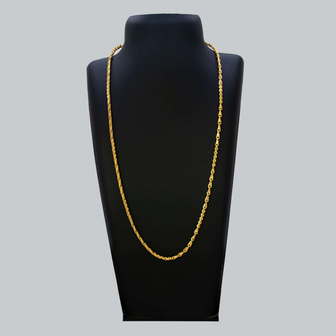 Stylish Gold Plated Cutting Bhanu Priya Chain displayed on a black necklace stand.