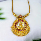 Ethnic Gold Plated Ruby Stones Lakshmi Pendant Necklace decorated with ruby stones and intricate gold bead detailing.
