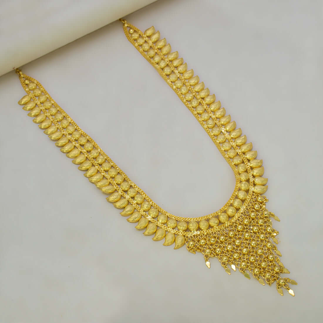 Elegant Gold Plated Bridal Mango Long Necklace showcasing intricate mango motifs and detailed engraving.