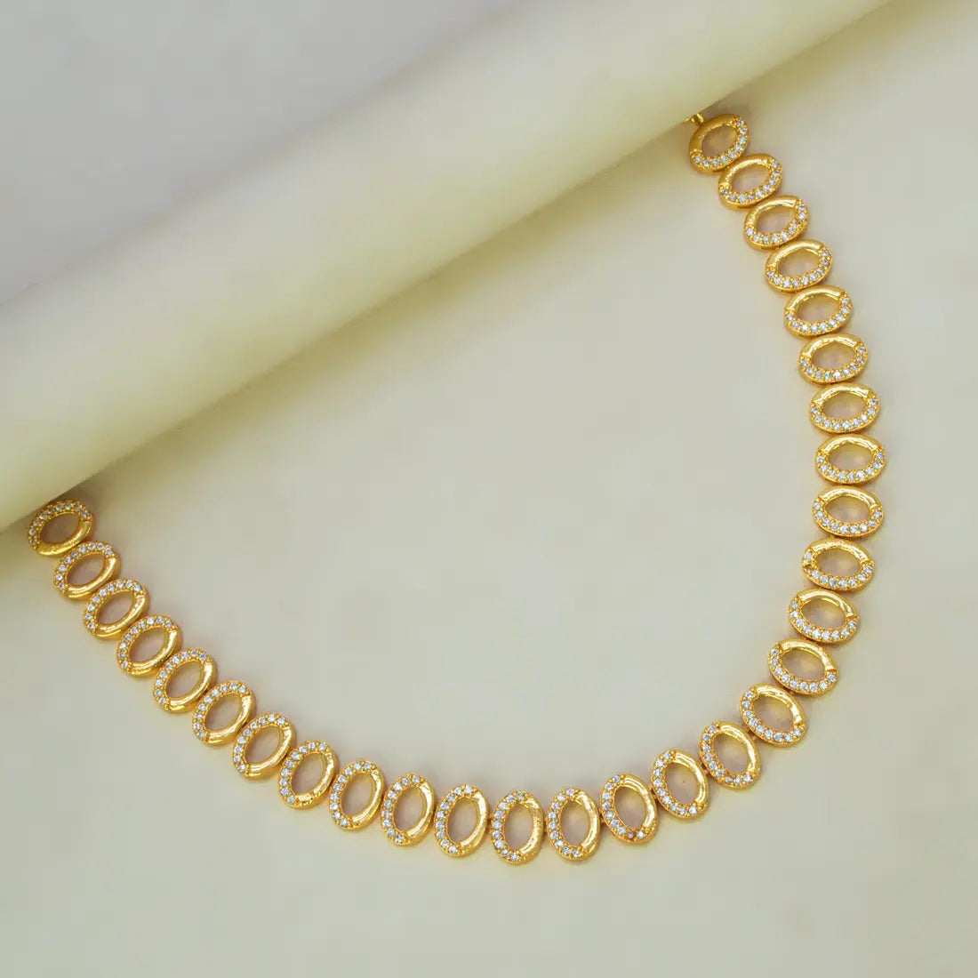 Gold Plated Oval CZ Stone Necklace featuring sparkling cubic zirconia in a gold finish.