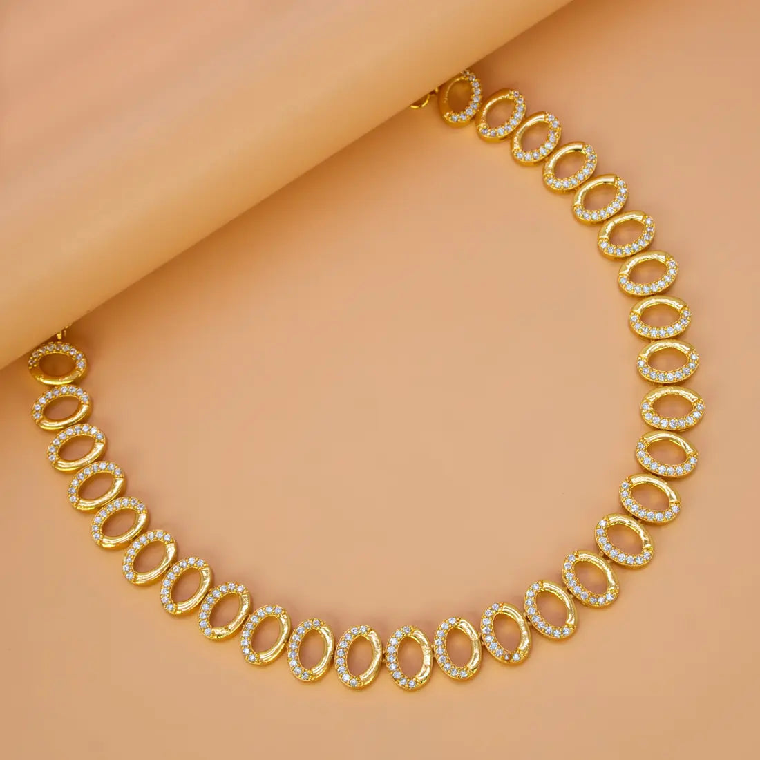 Gold Plated Oval CZ Stone Necklace featuring a line of sparkling cubic zirconia stones set in gold.