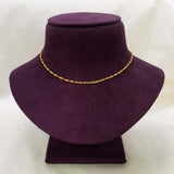 A delicate Popular Gold-Plated Twisted Singapore Chain displayed on a dark purple velvet jewelry bust against a light off-white background.