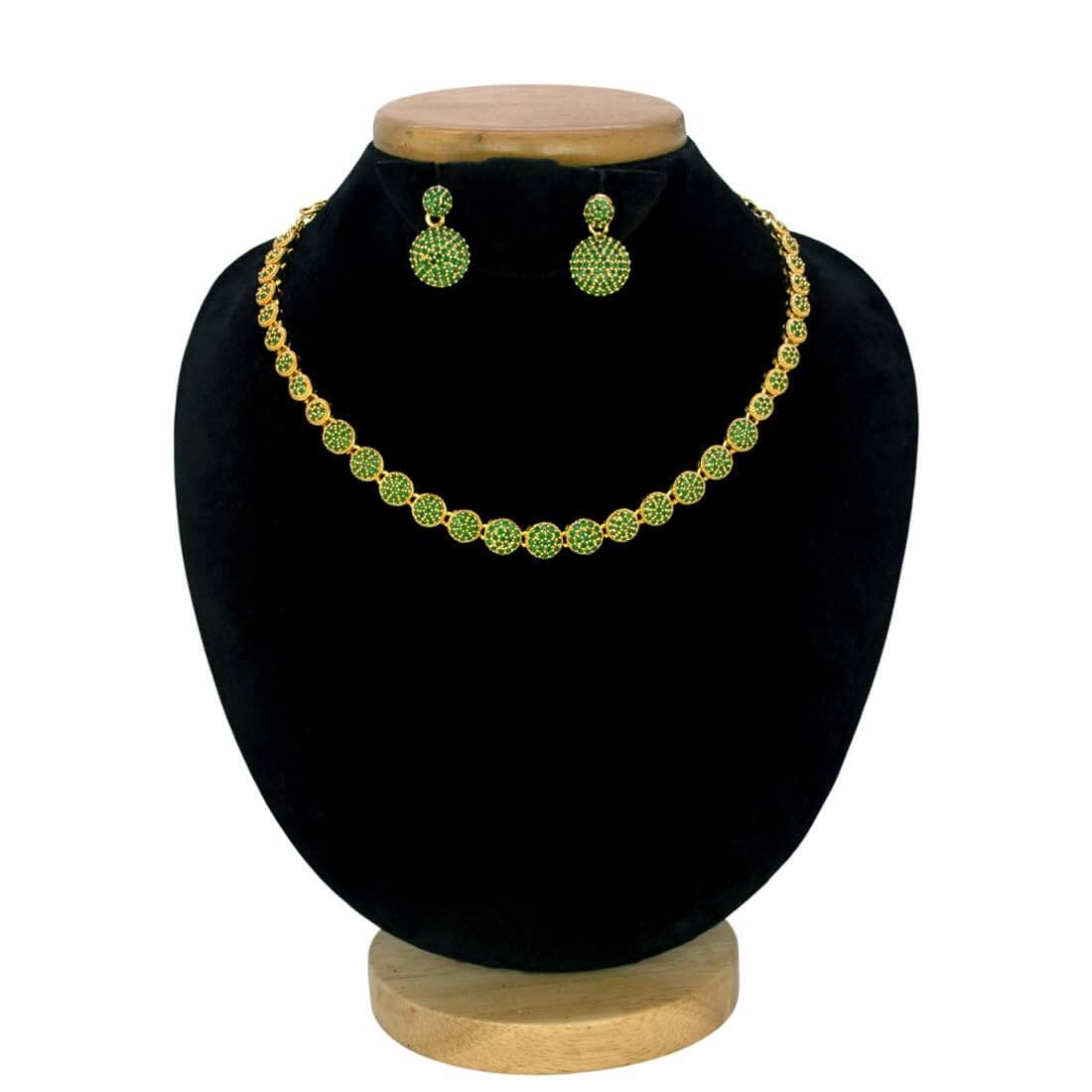 A Premium Gold Plated Round Emerald Necklace Set consisting of a necklace and matching earrings, displayed on a black velvet jewelry bust with a wooden base against a white background.