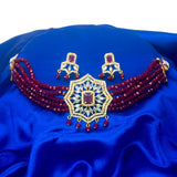 Multi-Strand Maroon Crystal Beaded Ruby CZ Choker Set for ladies on blue fabric background.