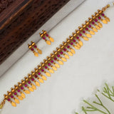 Kemp Stone Antique Gold Plated Elakkathali Necklace Set featuring vibrant kemp stones and gold leaf drops.