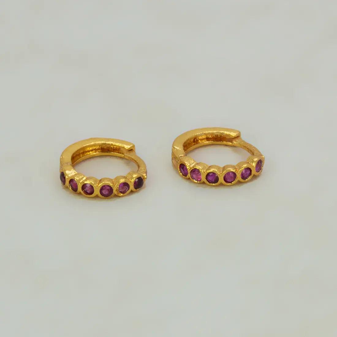 Gold Plated Stone Hoop Earrings for Women with ruby stones, showcasing elegance and sparkle.