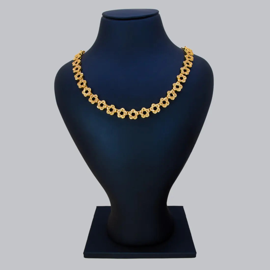 Gold Plated Star Design CZ Stone Necklace | Cubic Zirconia Statement Jewelry for Women displayed on a bust.
