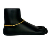 Trendy Gold Plated Urvashi Chain Anklet on a black mannequin foot against a white background