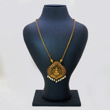 A pair of Victorian Style Lakshmi Kemp Stone Pendant Chain displayed on a black Y-shaped jewelry stand against a softly blurred indoor background with brown and white tones.