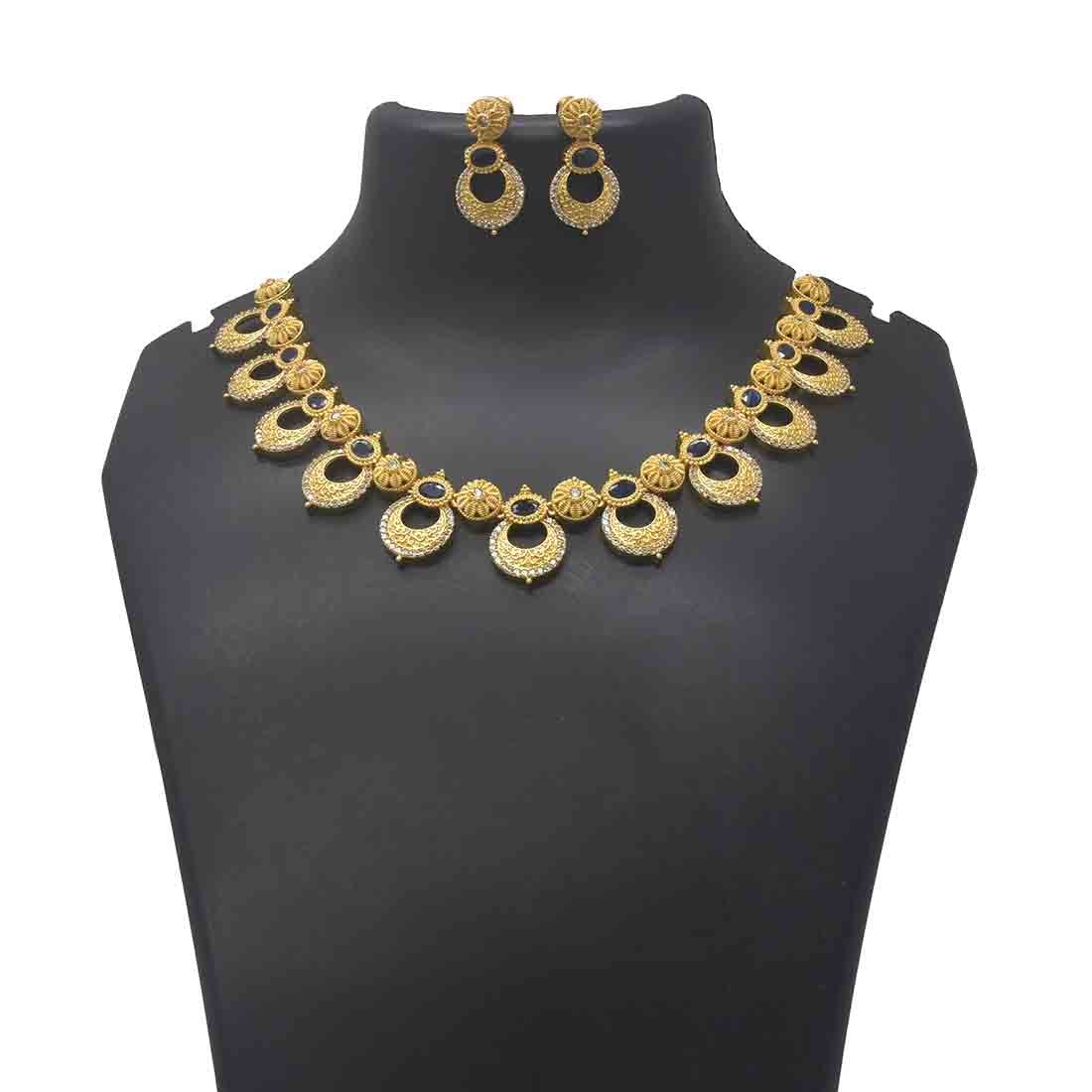 AD Blue Sapphire Floral Chandbali Necklace Set with gold-plated intricate design and matching earrings.