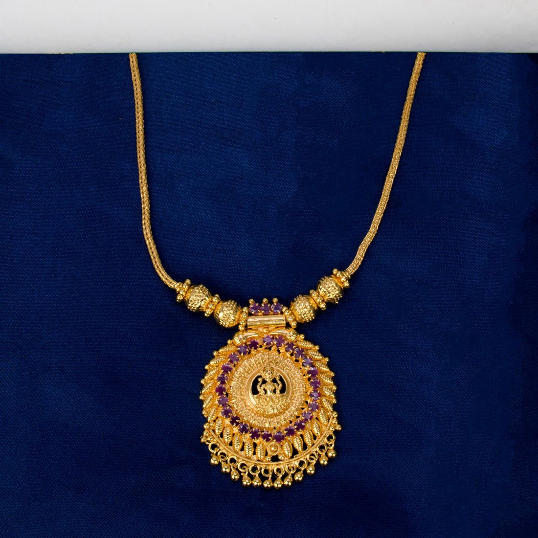 Contemporary Gold Plated Ruby Stones Lakshmi Pendant Necklace - K Supreme