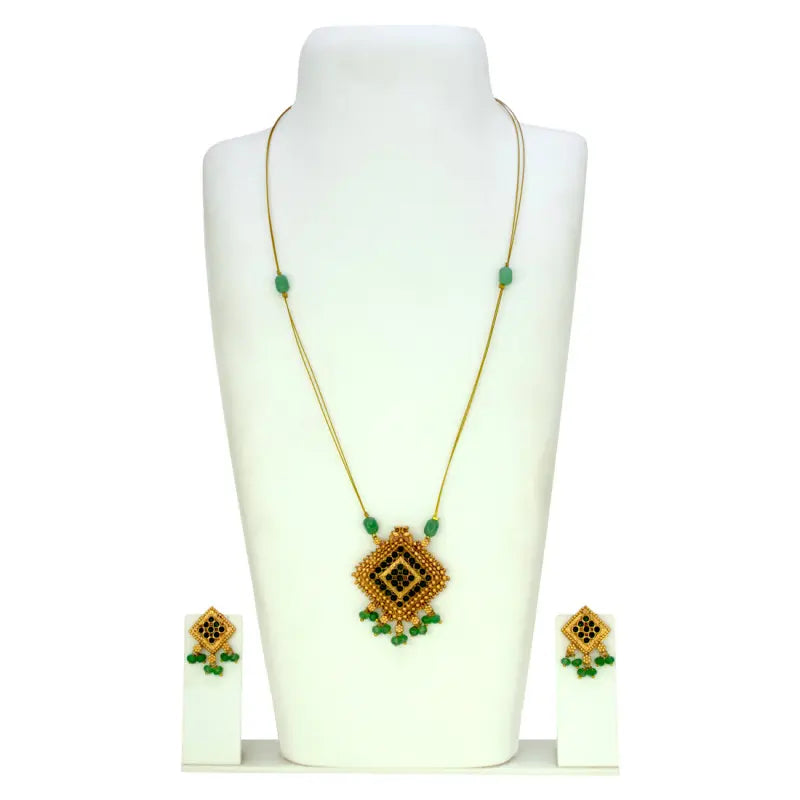 Fashion Invisible Chain Antique Green Stone Pendant Set displayed with matching earrings on a jewelry stand.