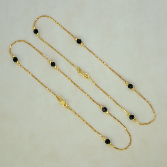 K Supreme gold plated brass anklets with box chain, black crystals, and gold beads. S hook closure.