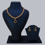 K Supreme gold-plated necklace set with peacock motifs and a ruby red cubic zirconia pendant and matching earrings.