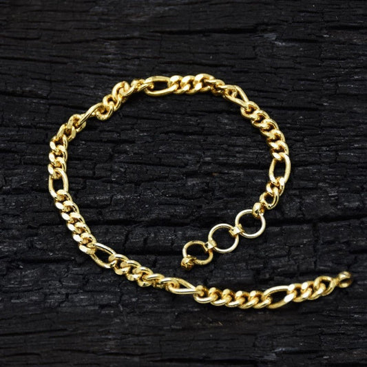 K Supreme gold plated brass figaro chain bracelet with S hook closure, 8 inches long, 4mm wide.