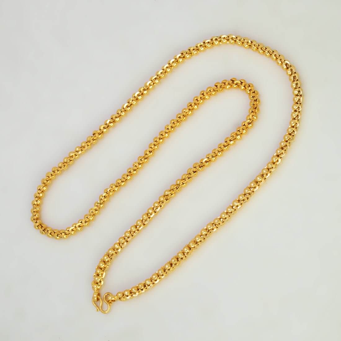 Trendy Gold Plated Designer Rail Chain displayed on a neutral background, showcasing its luxurious gold shine and elegant design.